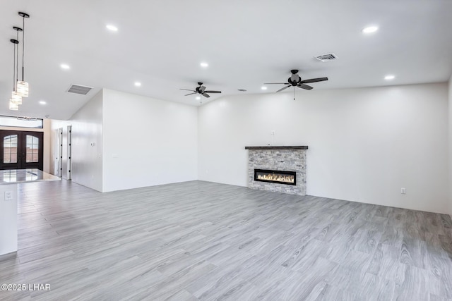 4801 N Diana Ave, Lake Havasu City, AZ 86404 - unfurnished living room with recessed lighting, a stone fireplace, wood finished floors, french doors, and a ceiling fan