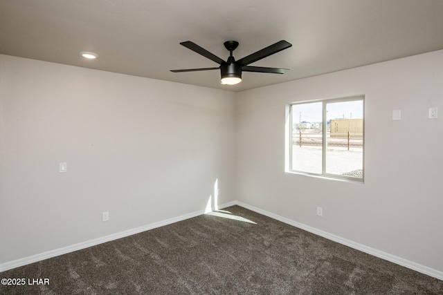 unfurnished room with ceiling fan and carpet floors