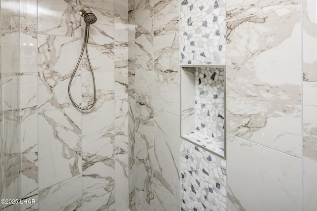 bathroom featuring tiled shower