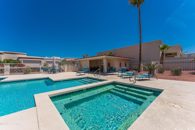 view of swimming pool with a patio