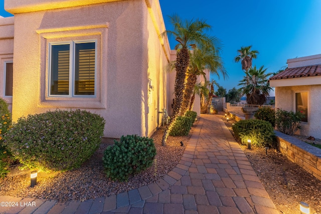 view of property exterior at dusk