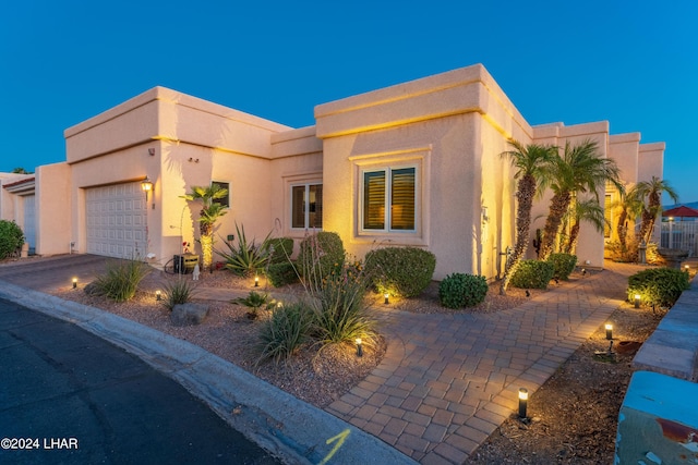 view of front of property with a garage