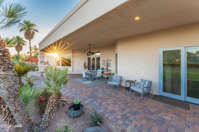 patio terrace at dusk with ceiling fan