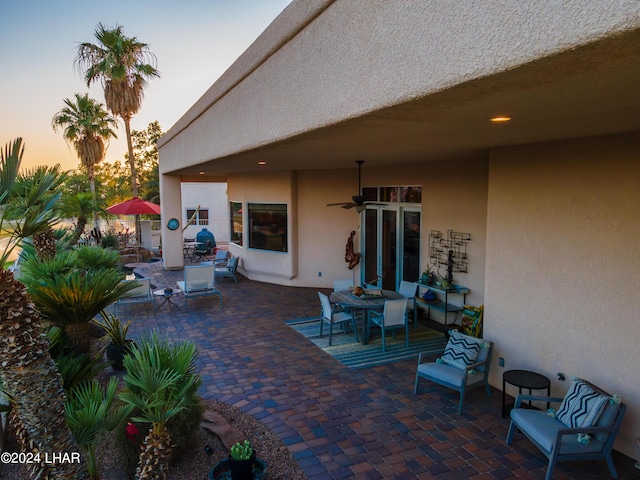 patio terrace at dusk with ceiling fan