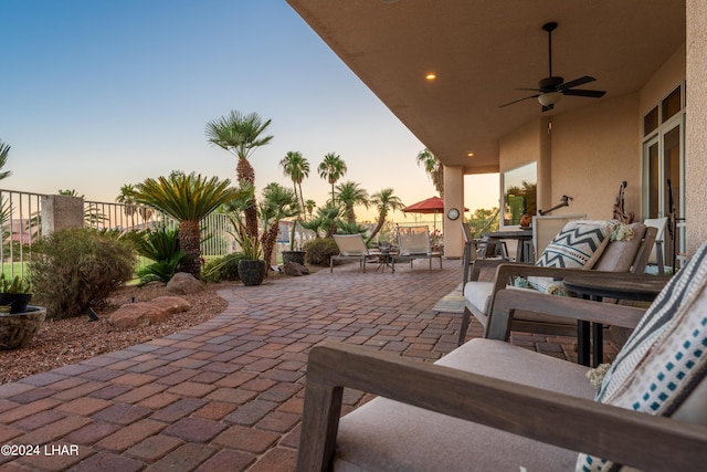 patio terrace at dusk with ceiling fan