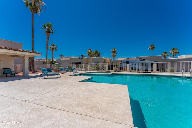 view of swimming pool featuring a patio