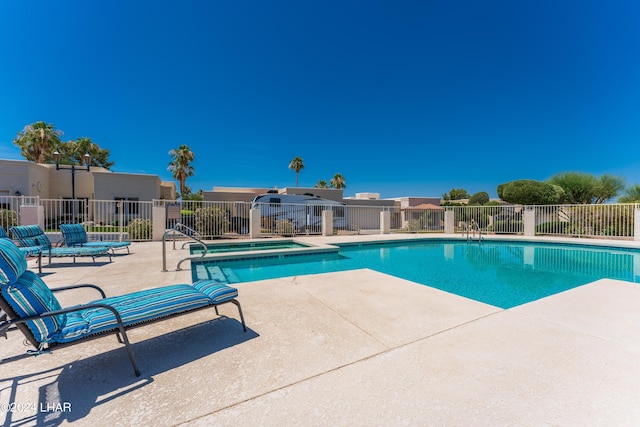 view of swimming pool featuring a patio area