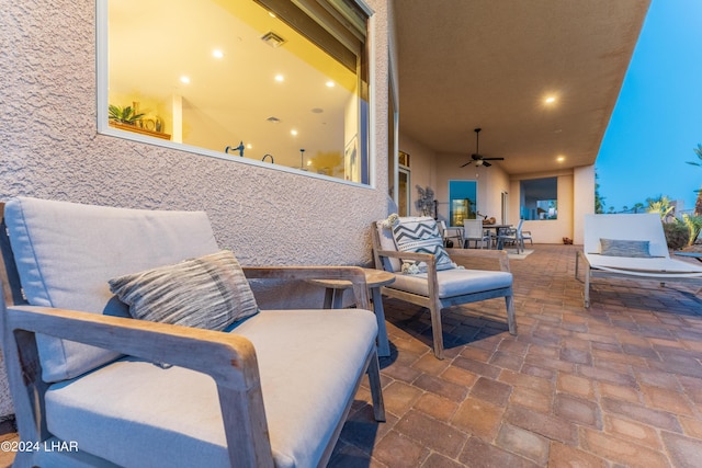 view of patio / terrace featuring ceiling fan