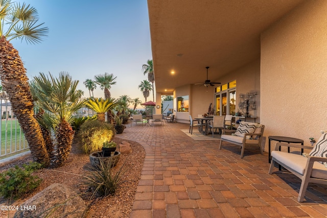 patio terrace at dusk with ceiling fan