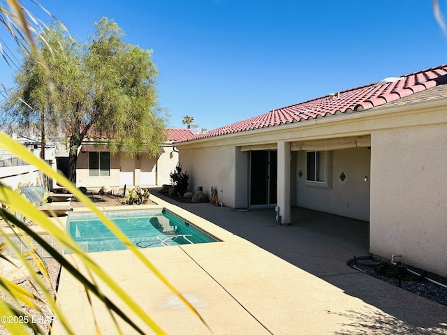 pool with a patio area