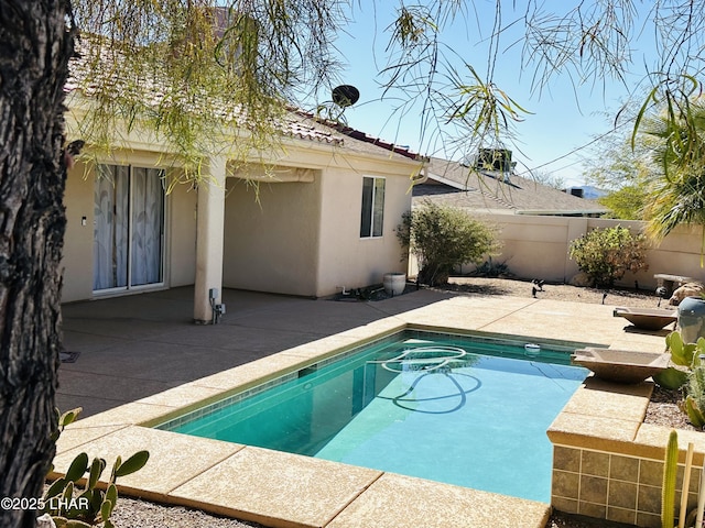 view of swimming pool with a patio area, fence private yard, and a fenced in pool