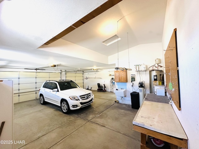 garage with a garage door opener, a sink, and electric water heater