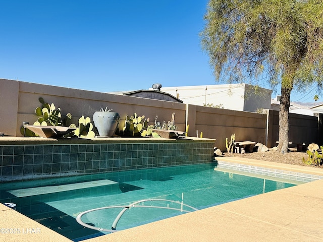 view of pool featuring a fenced in pool and fence