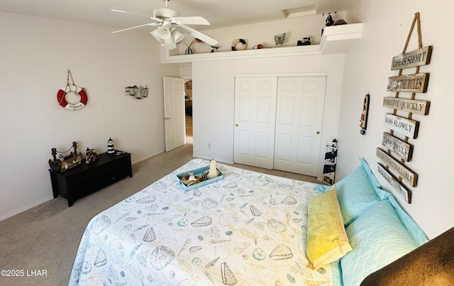 bedroom featuring a ceiling fan, carpet, and a closet