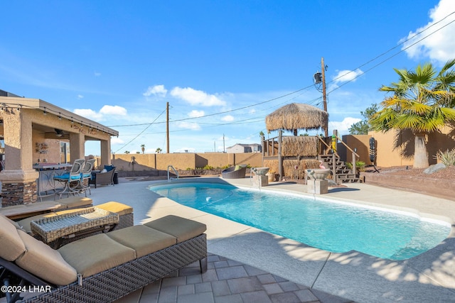 view of swimming pool with a gazebo, a patio area, a fenced backyard, and a fenced in pool