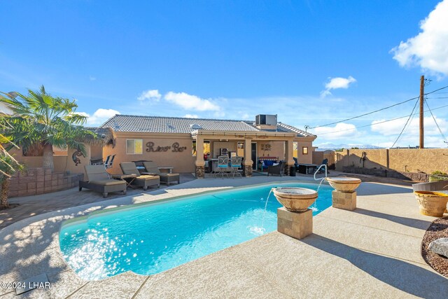 view of pool featuring an outdoor living space, a fenced in pool, central AC unit, a fenced backyard, and a patio