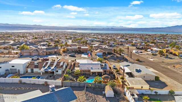 birds eye view of property with a mountain view and a residential view