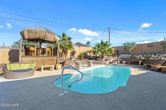 view of swimming pool with a fenced in pool, a patio, and a fenced backyard