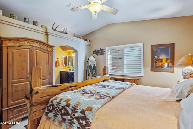 bedroom with visible vents, arched walkways, ceiling fan, vaulted ceiling, and connected bathroom