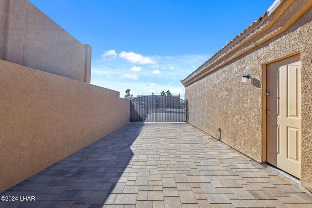 view of patio / terrace featuring a gate