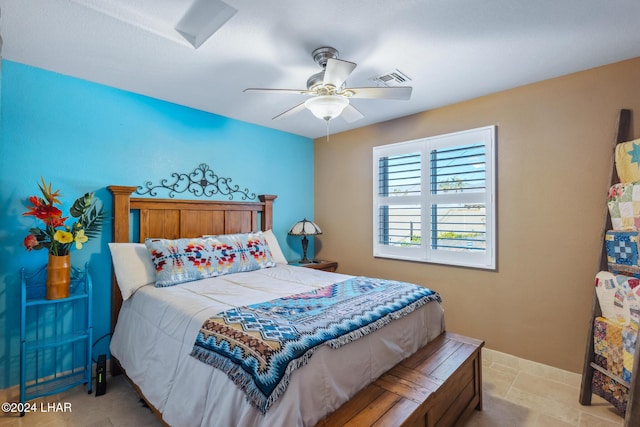 bedroom featuring visible vents, baseboards, and a ceiling fan