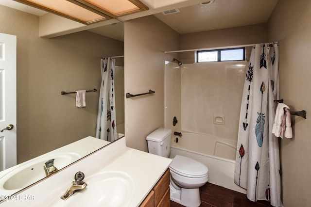 full bathroom with shower / tub combo, vanity, hardwood / wood-style flooring, and toilet