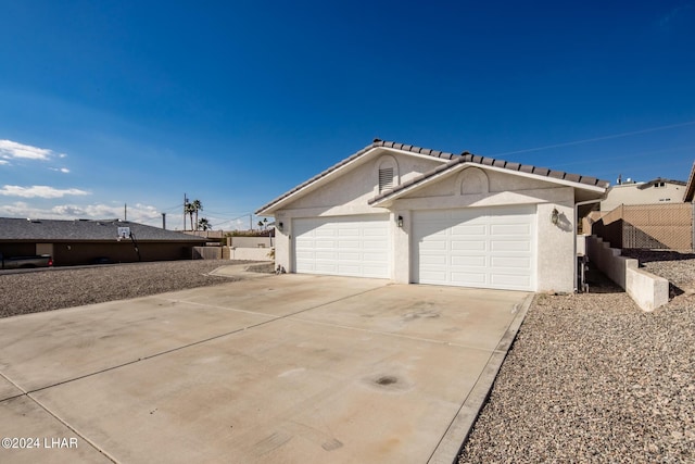 view of side of property featuring a garage