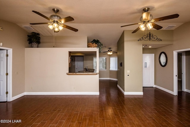 unfurnished living room with vaulted ceiling, ceiling fan, and dark hardwood / wood-style flooring