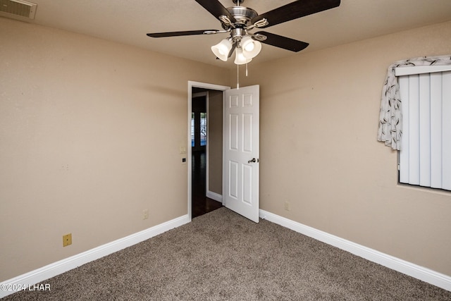 unfurnished bedroom with carpet floors and ceiling fan