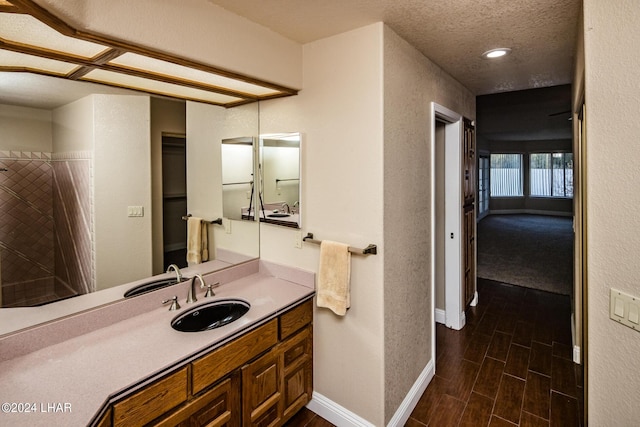 bathroom featuring vanity and a textured ceiling