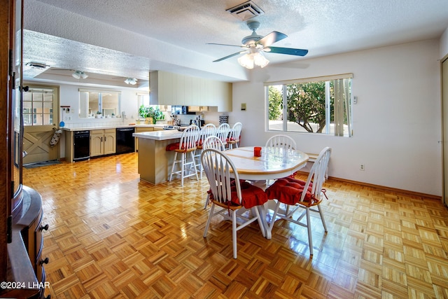 dining space featuring ceiling fan, light parquet flooring, beverage cooler, and a textured ceiling