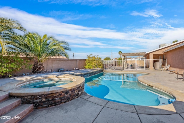 view of swimming pool with an in ground hot tub and a patio area