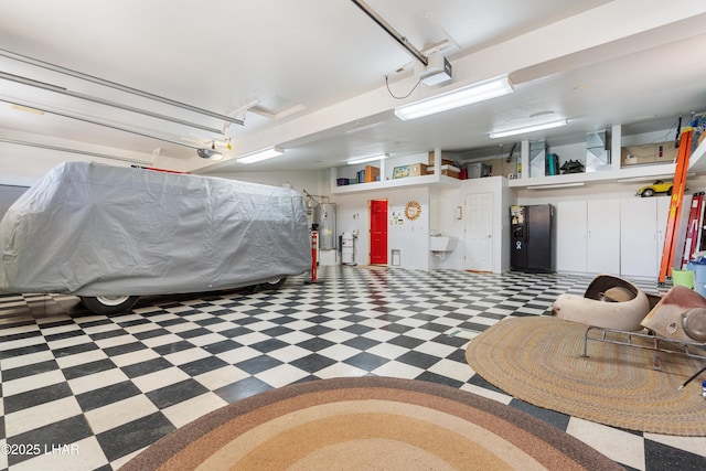 1901 Gold Dust Dr, Lake Havasu City, AZ 86404 - garage featuring water heater, a garage door opener, and a sink