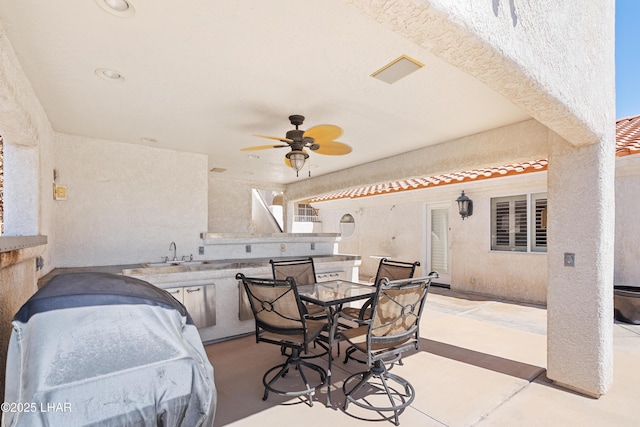 1901 Gold Dust Dr, Lake Havasu City, AZ 86404 - view of patio featuring exterior kitchen, ceiling fan, outdoor dining space, and a sink
