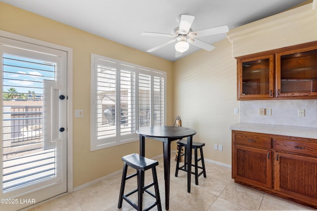 1901 Gold Dust Dr, Lake Havasu City, AZ 86404 - dining area featuring plenty of natural light, ceiling fan, light tile patterned floors, and baseboards