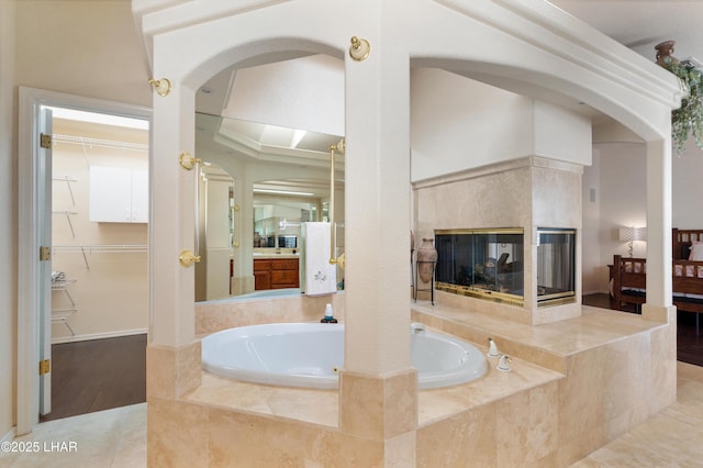 1901 Gold Dust Dr, Lake Havasu City, AZ 86404 - ensuite bathroom with a bath, a fireplace, and a walk in closet