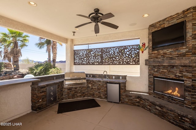 2008 Martinique Dr, Lake Havasu City, AZ 86406 - view of patio with an outdoor stone fireplace, an outdoor kitchen, and ceiling fan