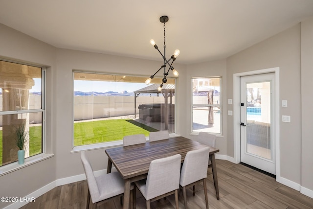 2008 Martinique Dr, Lake Havasu City, AZ 86406 - dining space with plenty of natural light, wood finished floors, and a chandelier