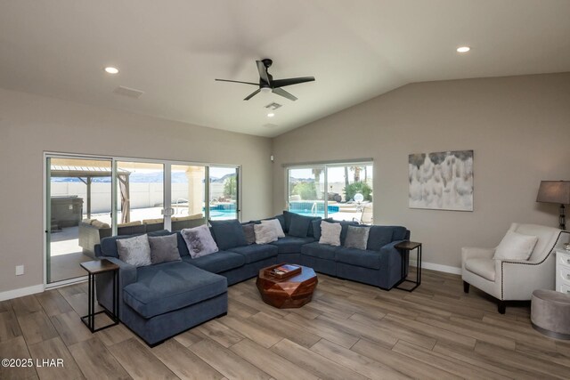 2008 Martinique Dr, Lake Havasu City, AZ 86406 - living room with wood finished floors, vaulted ceiling, ceiling fan, and recessed lighting