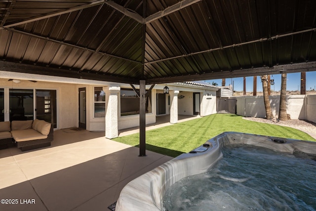2008 Martinique Dr, Lake Havasu City, AZ 86406 - view of patio featuring a hot tub and an outdoor living space