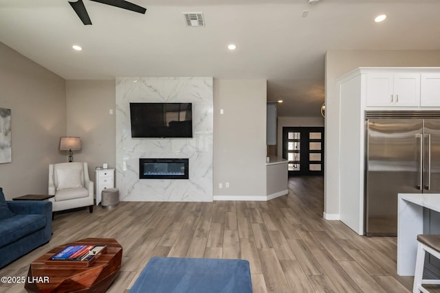 2008 Martinique Dr, Lake Havasu City, AZ 86406 - living room with ceiling fan, light wood-style floors, a high end fireplace, and recessed lighting