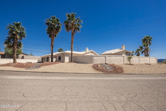 2008 Martinique Dr, Lake Havasu City, AZ 86406 - ranch-style house with a chimney, stucco siding, and a tiled roof