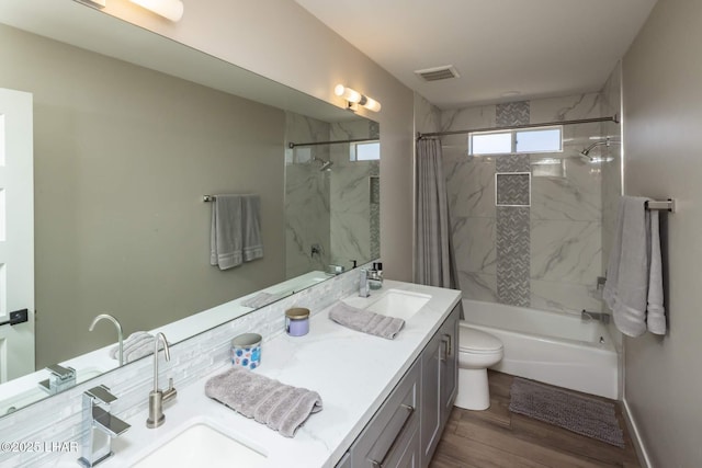 2008 Martinique Dr, Lake Havasu City, AZ 86406 - bathroom featuring vanity, shower / bathtub combination with curtain, and wood finished floors