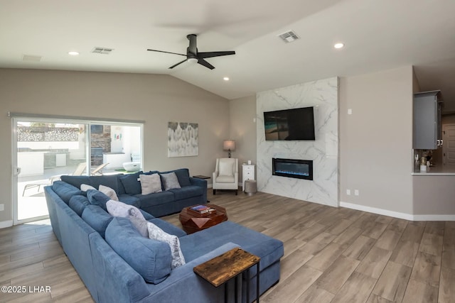 2008 Martinique Dr, Lake Havasu City, AZ 86406 - living area featuring light wood-type flooring, lofted ceiling, a ceiling fan, a premium fireplace, and recessed lighting