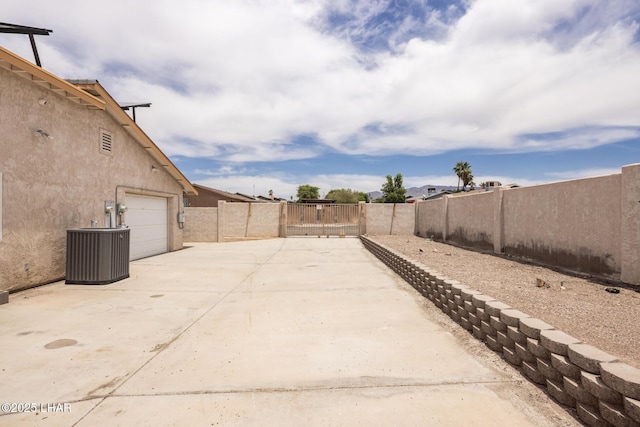 2230 Havasupai Blvd, Lake Havasu City, AZ 86403 - view of patio with concrete driveway and central AC