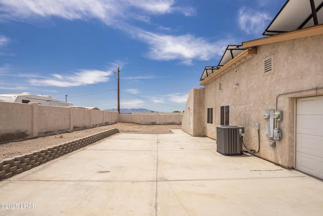 2230 Havasupai Blvd, Lake Havasu City, AZ 86403 - fenced backyard featuring central air condition unit and a patio