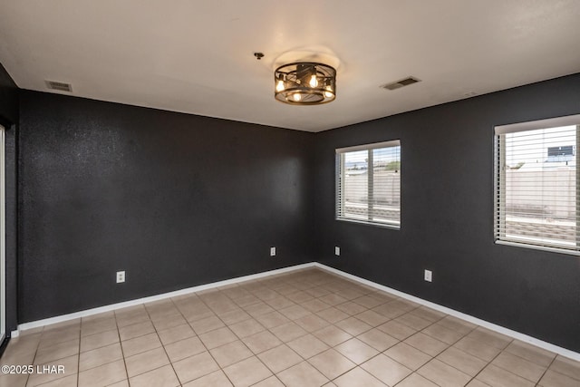 2230 Havasupai Blvd, Lake Havasu City, AZ 86403 - spare room featuring baseboards and light tile patterned flooring