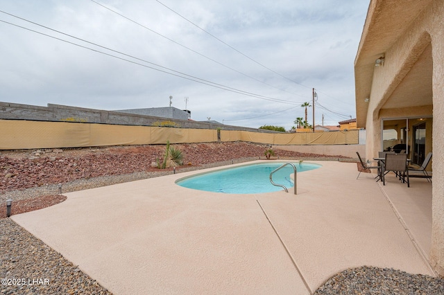 view of pool featuring a fenced in pool, a patio area, and a fenced backyard