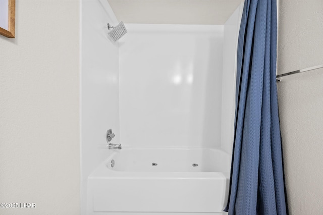 full bathroom featuring shower / bathtub combination with curtain