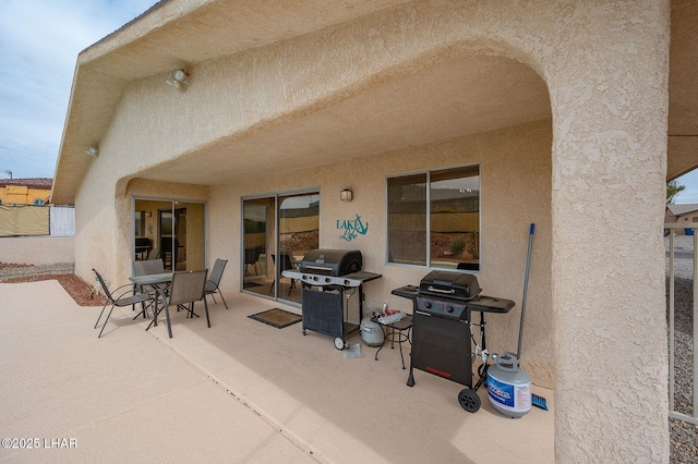 view of patio / terrace featuring outdoor dining space and grilling area